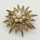 A 9ct gold star brooch set with seed pearls. Weight 6.9g
