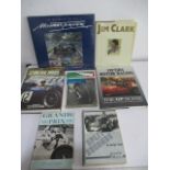 A collection of Formula 1 racing related books, including Stirling Moss, Jim Clark, Split