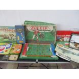 A collection of various vintage board games including Chad Valley Soccer, Totopoly, Cluedo, Draughts
