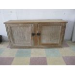 A two door pine cupboard