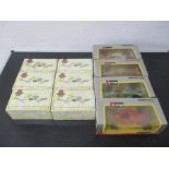 A collection of four boxed Burago model formula one racing cars, along with six boxed Matchbox