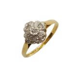 An 18ct gold ring with square shaped diamond cluster