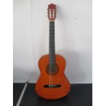 A Stagg handmade classical guitar in carry case- model number 0542