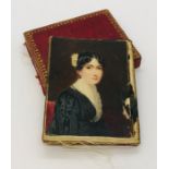A miniature portrait on ivory of a lady in mourning dress, unsigned. Case A/F