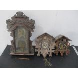 Two vintage cuckoo clocks, along with one other