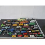 A collection of play worn die cast vehicles