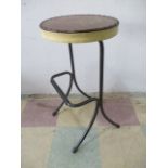 An industrial stool with foot rest