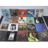 A collection of 7" vinyl singles including Wings, The Jam, Bee Gees, Deep Purple, Elton John,