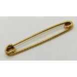 An 18ct gold 'kilt' pin. Weight 4.1g