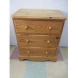 A small pine chest of three drawers