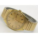 A gentleman's gold plated Omega Automatic Geneve wristwatch with date aperture, original strap