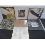 A collection of seven Led Zeppelin vinyl records including Physical Graffiti, Swan Song, Led
