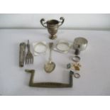 A small silver trophy, serviette ring, thimble along with various other items