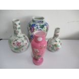 Three Chinese vases decorated with insects etc. along with a pink glass vase