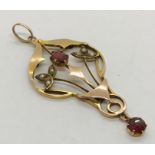 An Art Nouveau pendant set with garnets and seed pearls (hallmarked rubbed)