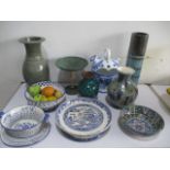 A collection of pottery including a willow pattern platter, studio pottery etc.