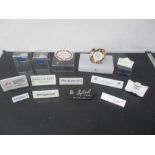 A collection of point of sale display signs including Wedgwood, John Beswick, Royal Crown Derby,