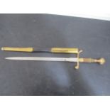 An officers dirk in leather and brass scabbard A/F
