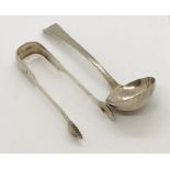 A Georgian silver ladle and a large pair of silver sugar tongs
