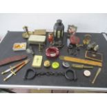 A collection of interesting items including antique hand cuffs ( no key) Oriental tea caddy,