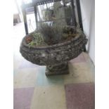 A large weathered garden planter on stand - diameter 70cm