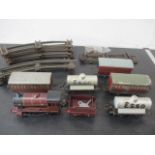 A clockwork 0 gauge tin plate Hornby locomotive (5600) and tender, Esso rolling stock, carriages,
