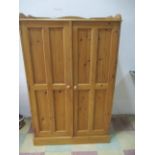 A small pine wardrobe, height approx 150cm
