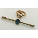 A 15ct gold and platinum bar brooch along with a 14ct gold Chinese ring. Total weight 4.4g