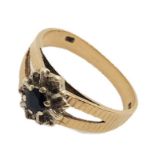 A 9ct gold ring with sapphire and diamonds