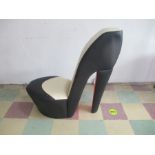 A high back chair in the form of a stiletto shoe