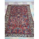 A red ground hand woven rug