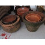 A collection of vintage terracotta pots