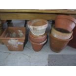 A collection of terracotta flowerpots