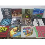 A box of progressive rock vinyl records including Jimi Hendrix, The Who, Doors, Traffic, Cream,