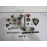 A small collection of vintage car badges including Jaguar, Peugeot, MG, Alfa-Romeo etc