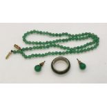 A jade necklace with 9ct gold clasp along with a silver and jade ring (marked 835) and earrings