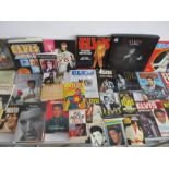 A collection of various Elvis Presley related books and annuals, along with a five cassette Elvis