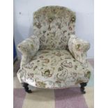 A Victorian button back armchair