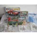 A collection of Airfix model kits for various vehicles including an Austin Mini, Triumph TR4A,
