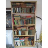 A large collection of various vintage books - over four shelves