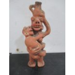 A Mayan style terracotta figure of mother and child, 34 cm height