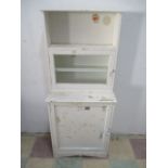 A white painted small dresser, with glazed cupboard