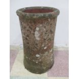 A small well weathered chimney pot