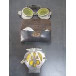 A pair of motoring goggles along with a leather pouched tool kit and an AA badge
