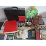 A collection of miscellaneous items including a camera lens, Winnie the Pooh & Trigger small soft