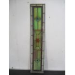 A vintage narrow stained glass panel