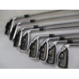 A set of Taylor Made "Tour Burner" golf clubs, includes irons four to nine, pitching & sand wedge.
