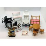 A collection of nursery related dolls house items including rocking horse, crib, toy fort etc