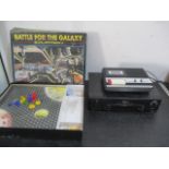 A board game "Battle for the Galaxy- Zylattron" along with a cassette recorder and a Philips VCR
