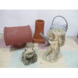 A terracotta chimney cowl, chimney pot along with a garden figure of a frog, watering can etc.